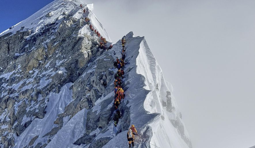 Mountaineers form a queue as they approach the summit of Mount Everest in Nepal, May 18, 2025. (AP Photo/Kunga Sherpa) **FILE**