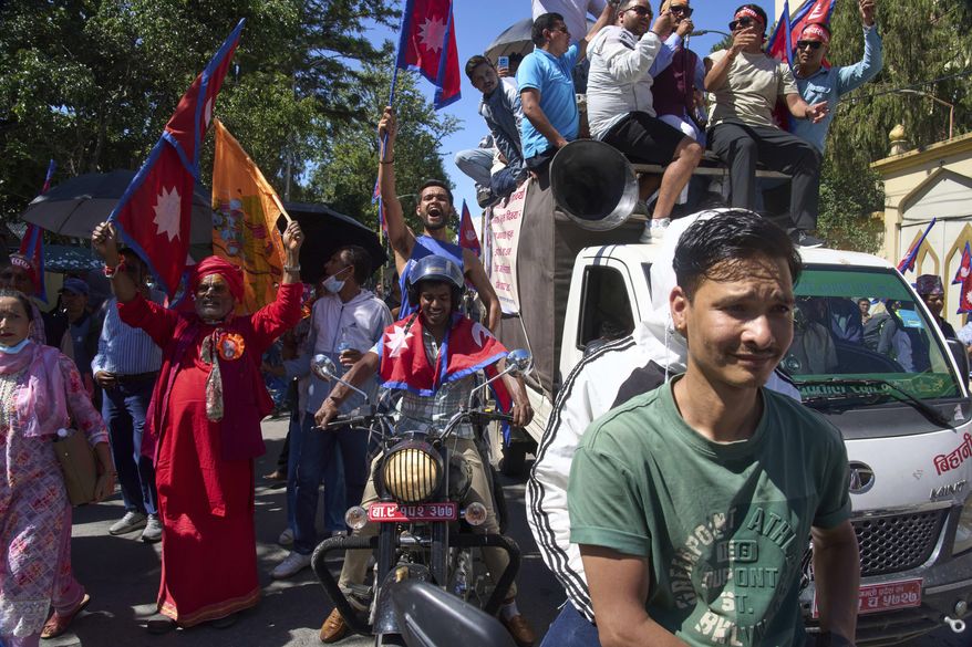 Pro-monarchy supporters take part in a rally calling for the restoration of Nepal's monarchy in Kathmandu, Nepal, Thursday, May 29, 2025. (AP Photo/Niranjan Shrestha)