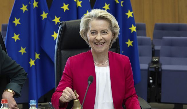 European Commission President Ursula von der Leyen rings a bell to signify the beginning of the weekly college of commissioners meeting at EU headquarters in Brussels, Wednesday, May 21, 2025. (AP Photo/Omar Havana) ** FILE **