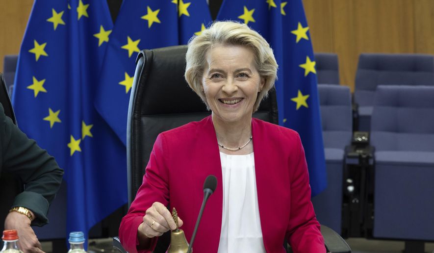 European Commission President Ursula von der Leyen rings a bell to signify the beginning of the weekly college of commissioners meeting at EU headquarters in Brussels, Wednesday, May 21, 2025. (AP Photo/Omar Havana) ** FILE **