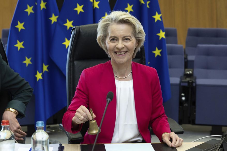 European Commission President Ursula von der Leyen rings a bell to signify the beginning of the weekly college of commissioners meeting at EU headquarters in Brussels, Wednesday, May 21, 2025. (AP Photo/Omar Havana) ** FILE **