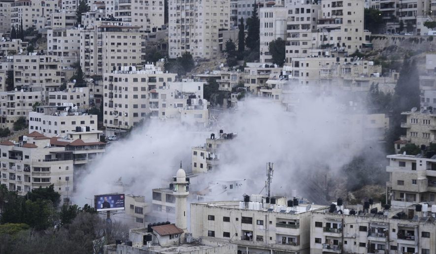 Smoke rises as the Israeli forces demolish the home of Jaafar Mona, a Palestinian militant who died when the bomb he was carrying in Tel Aviv exploded, apparently prematurely, last August. In the West Bank City of Nablus on Thursday, May 29, 2025. (AP Photo/Majdi Mohammed)