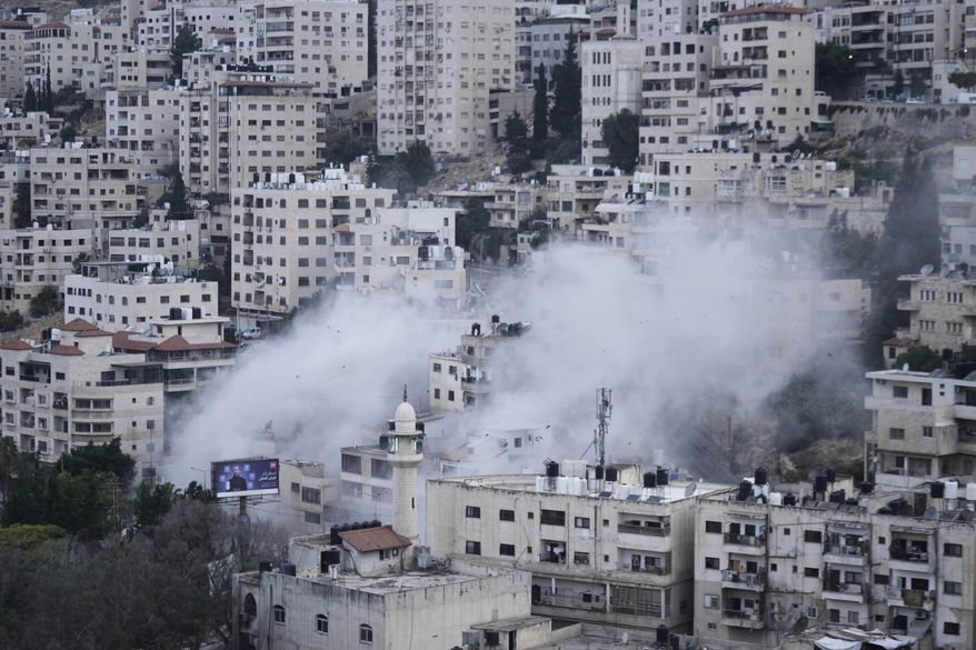 Smoke rises as the Israeli forces demolish the home of Jaafar Mona, a Palestinian militant who died when the bomb he was carrying in Tel Aviv exploded, apparently prematurely, last August. In the West Bank City of Nablus on Thursday, May 29, 2025. (AP Photo/Majdi Mohammed)