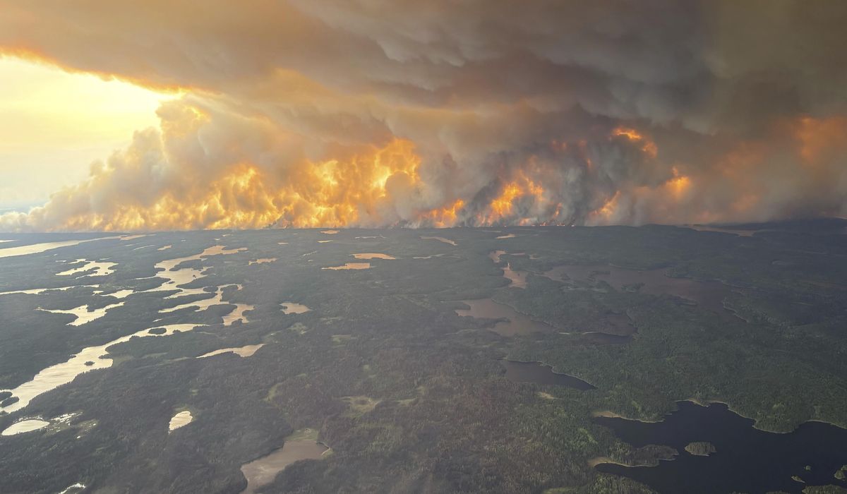 NextImg:Winds push smoke from Canadian wildfires south into U.S. and worsen air quality