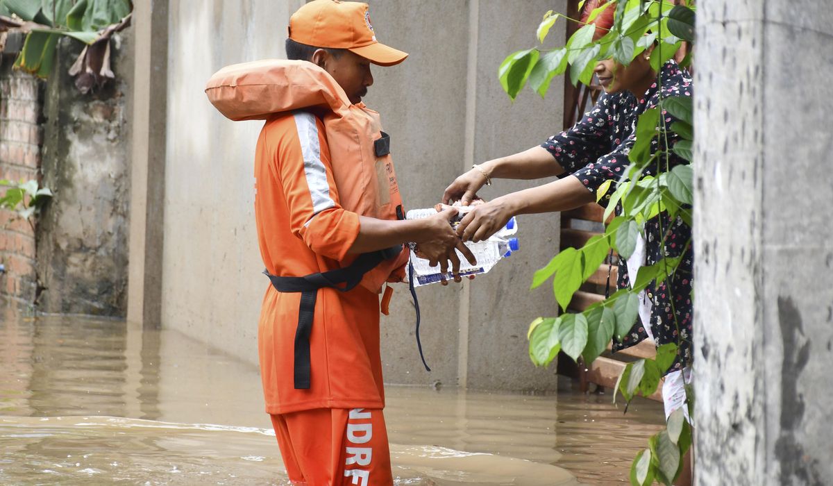 NextImg:India’s monsoon floods kill at least 22 people in the country’s northeast