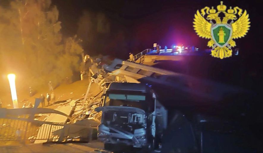 In this photo released by Moscow Interregional Transport Prosecutor's Office telegram channel on Sunday, June 1, 2025, emergency employees work at a damaged bridge in Russia's Bryansk region, which borders Ukraine. (Moscow Interregional Transport Prosecutor's Office telegram channel via AP)