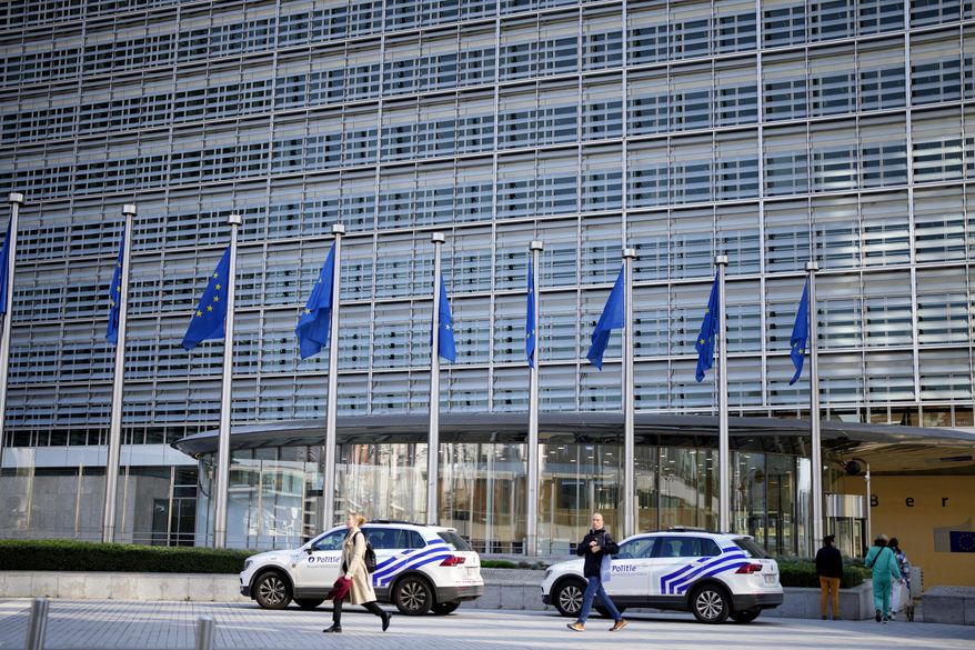 FILE - Police cars stand outside EU headquarters in Brussels, Sept. 30, 2022. (AP Photo/Virginia Mayo, file)