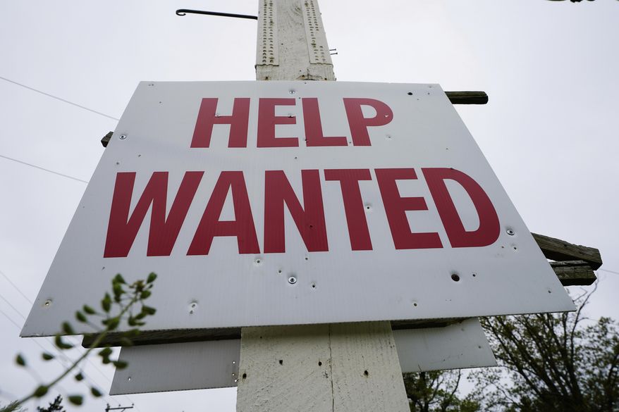 A help wanted sign is posted in Lansdale, Pa., Friday, April 28, 2023. (AP Photo/Matt Rourke, File)
