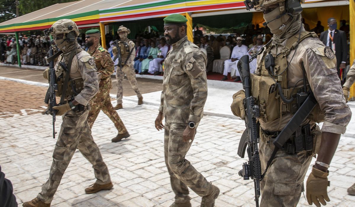 NextImg:Extremists kill dozens of soldiers at a Mali military base, sources say