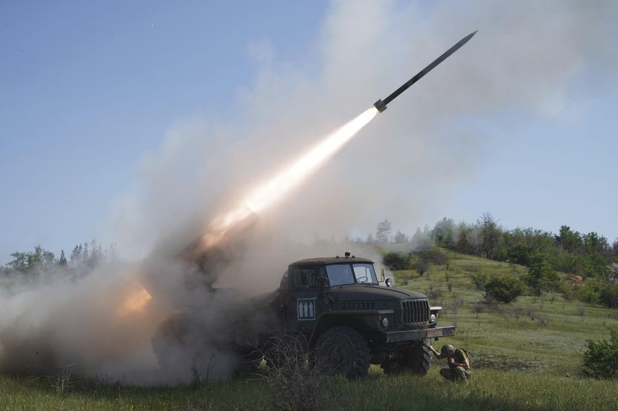 Soldiers of Ukraine's 30th Separate Mechanized Brigade fire a Grad multiple rocket launcher towards Russian positions at the frontline in Donetsk region, Ukraine, Tuesday, June 3, 2025. (AP Photo/Andrii Marienko)