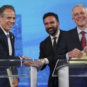 Democratic mayoral candidates Andrew Cuomo, left, shakes hands with Zohran Mamdani, center, as Whitney Tilson reacts after participating in a Democratic mayoral primary debate, Wednesday, June 4, 2025, in New York. (AP Photo/Yuki Iwamura, Pool)