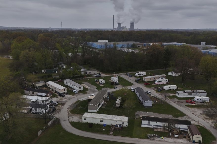 The Rockport Power Plant operates near a group of mobile homes Friday, April 11, 2025, in Rockport, Ind. (AP Photo/Joshua A. Bickel)