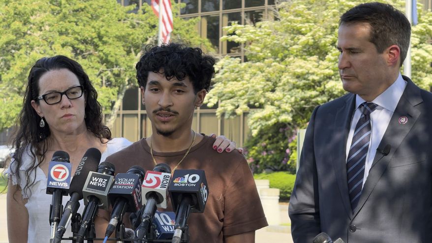 Marcelo Gomes da Silva, 18, center, a Massachusetts high school student who came to the U.S. from Brazil at age 7 and was detained by U.S. Immigration and Customs Enforcement agents Saturday, May 31, 2025, speaks to journalists after being released from detention on bond as Rep. Seth Moulton, D-Mass., right, listens, Thursday, June 5, in Burlington, Mass. (AP Photo/Rodrique Ngowi)