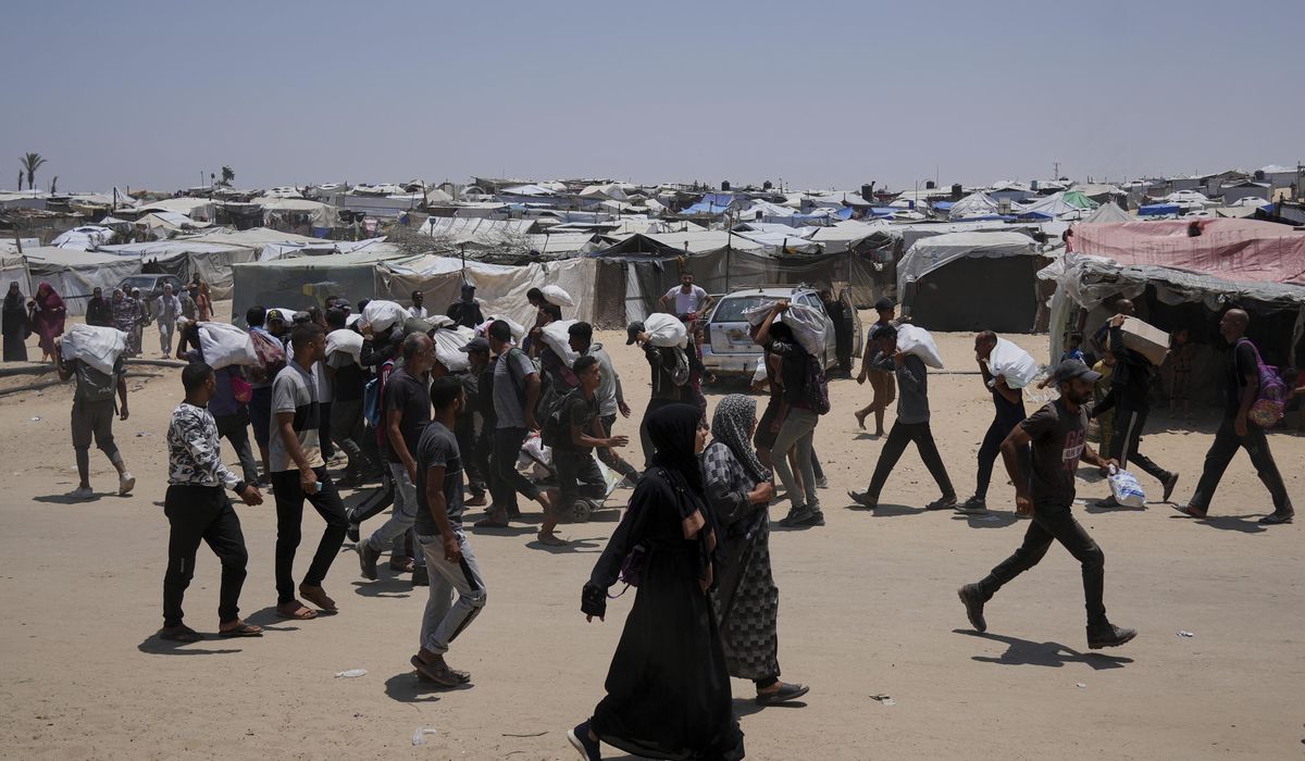 NextImg:Palestinians say Israeli fire kills 5 near aid sites. Israel says it fired warning shots