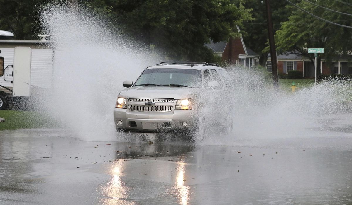 NextImg:At least 2 people killed as storms push through South