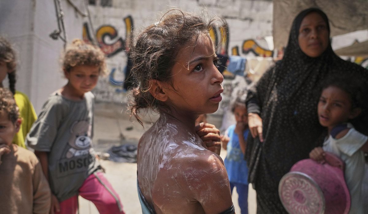 NextImg:Palestinians say Israeli forces fired toward crowds near Gaza aid site, killing 3