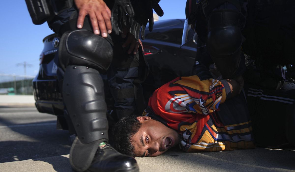 NextImg:Police arrest more than 20 people on first night of curfew aimed at protests in downtown Los Angeles