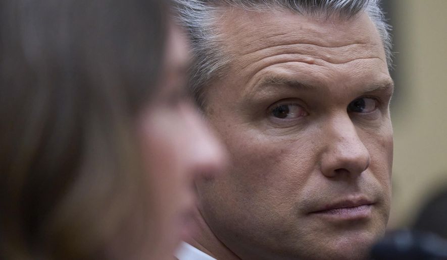 Secretary of Defense Pete Hegseth looks at Bryn MacDonnell, left, acting chief financial officer at the Department of Defense, as he fields questions on the Pentagon budget from the House Armed Services Committee, at the Capitol in Washington, Thursday, June 12, 2025. (AP Photo/J. Scott Applewhite) **FILE**
