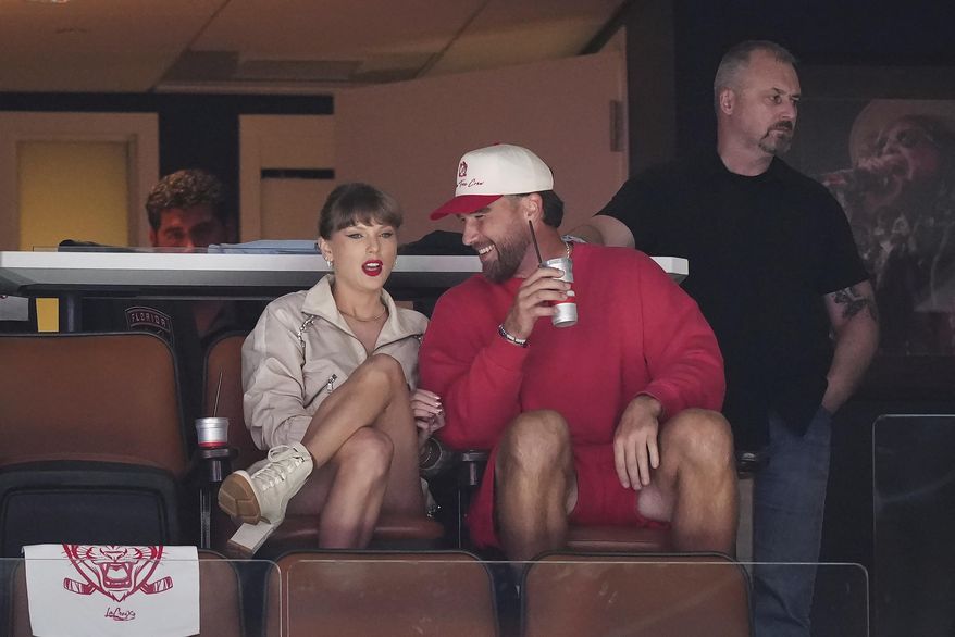 Singer Taylor Swift, front left, and Kansas City Chiefs football player Travis Kelce, front right, take in the third period in Game 4 of the NHL hockey Stanley Cup Final between the Edmonton Oilers and the Florida Panthers in Sunrise, Fla., Thursday, June 12, 2025. (Nathan Denette/The Canadian Press via AP) ** FILE **