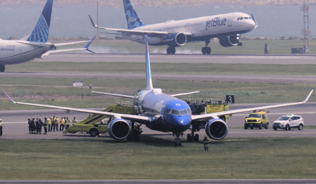 NextImg:JetBlue flight from Chicago rolls off runway and into the grass in Boston