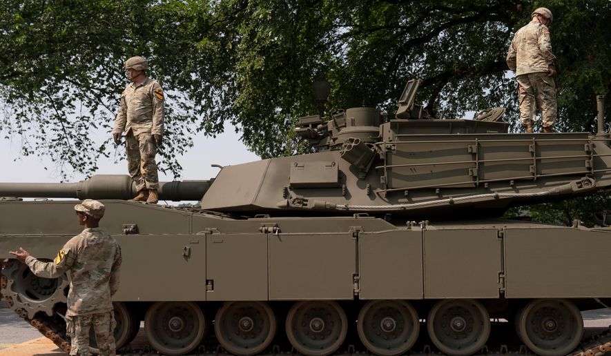 U.S. Army soldiers work on an M1 Abrams tank staged in West Potomac Park ahead of an upcoming military parade commemorating the Army's 250th anniversary and coinciding with Donald Trump's 79th birthday, Wednesday, June 11, 2025, in Washington (AP Photo/Julia Demaree Nikhinson) ** FILE **