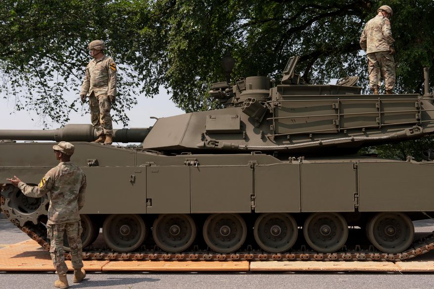 U.S. Army soldiers work on an M1 Abrams tank staged in West Potomac Park ahead of an upcoming military parade commemorating the Army's 250th anniversary and coinciding with Donald Trump's 79th birthday, Wednesday, June 11, 2025, in Washington (AP Photo/Julia Demaree Nikhinson) ** FILE **