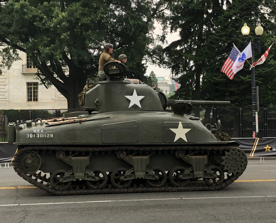 An M4 Sherman Tank, a staple of the Allied victory in World War II, rolls down Constitution Avenue Northwest on Saturday. Cheers and chants rang out Saturday from a crowd of thousands as soldiers manned modern and historic tanks and aircraft for the Army’s 250th anniversary celebration in the District. Photo: Matt Delaney / The Washington Times.