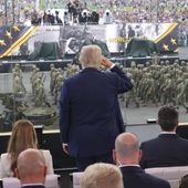 President Donald Trump, center, salutes passing troops during a parade to honor the Army's 250th anniversary, coinciding with Trump's 79th birthday, Saturday, June 14, 2025, in Washington. (Doug Mills/The New York Times via AP, Pool) **FILE**