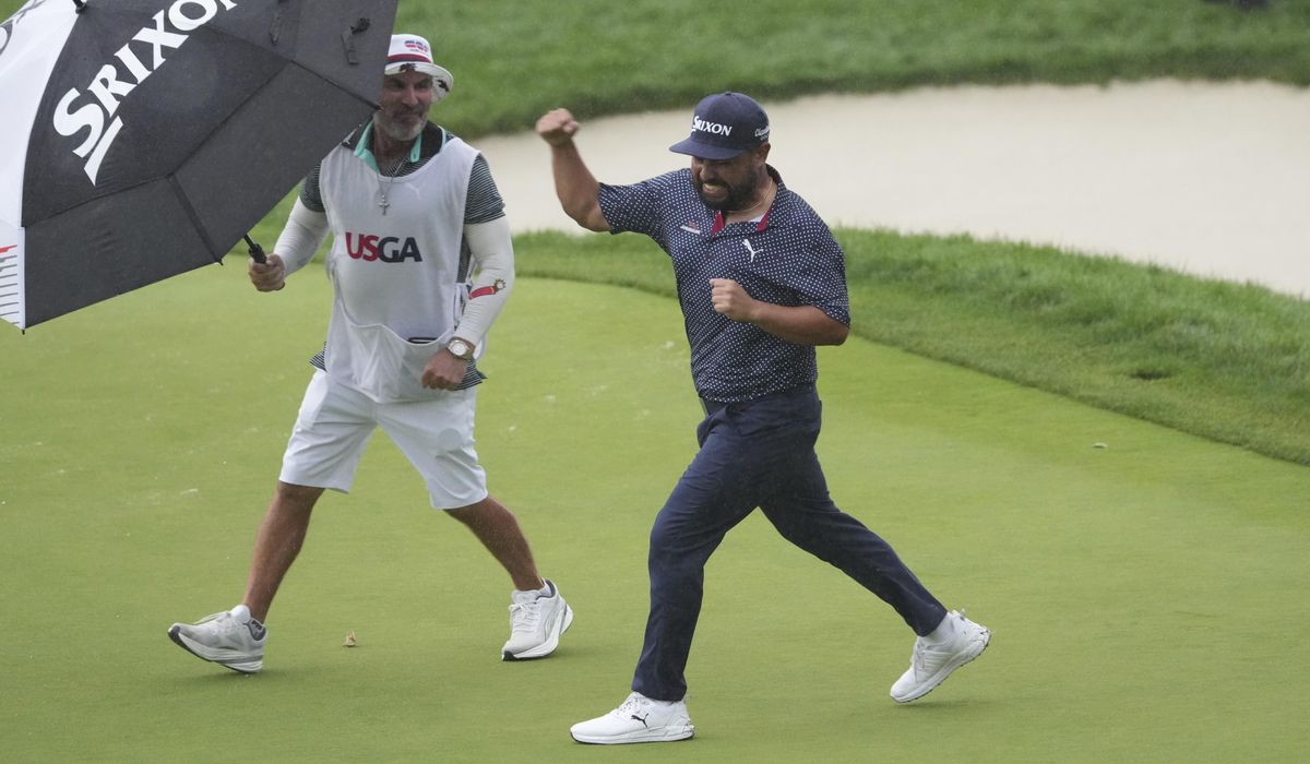 NextImg:Spaun weathers the worst of wet Oakmont to win U.S. Open