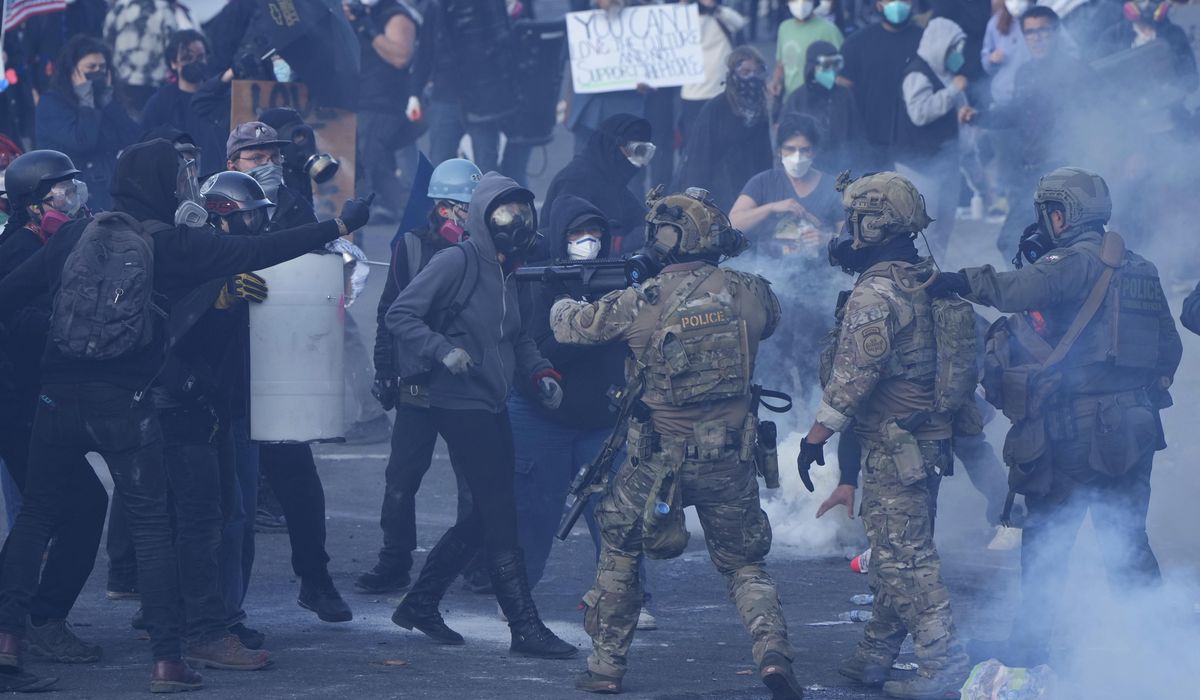 NextImg:Four protesters charged with assaulting officers, destruction outside Portland ICE office