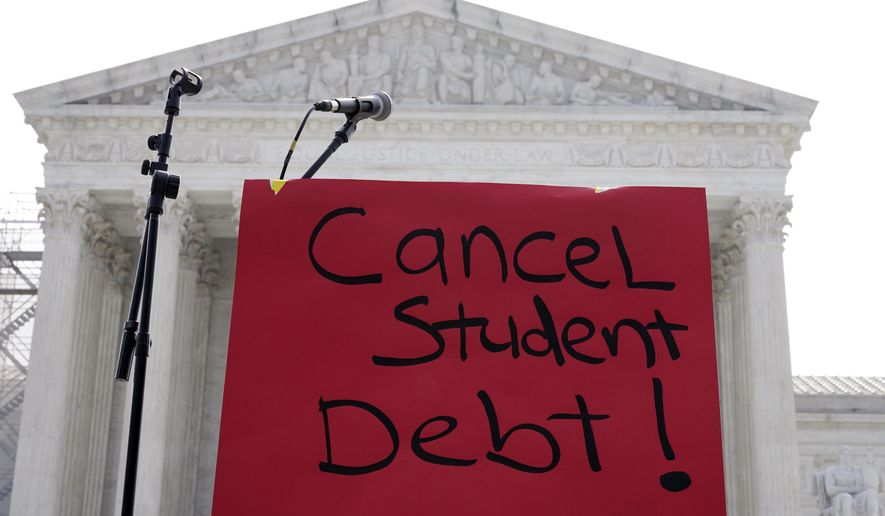 A sign reading "cancel student debt" is seen outside the Supreme Court in Washington on June 30, 2023. (AP Photo/Mariam Zuhaib) **FILE**