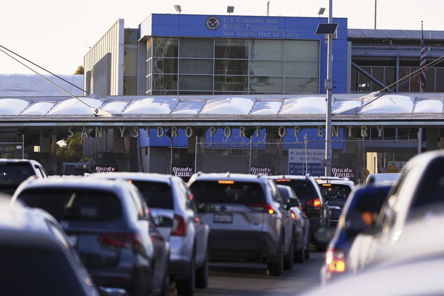 Vehicles wait in line to cross the border into the United States at the San Ysidro Port of Entry, March 18, 2025, in Tijuana, Mexico. (AP Photo/Gregory Bull) **FILE**