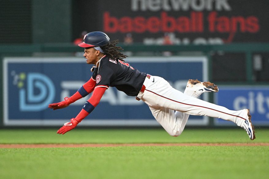 Washington Nationals shortstop C.J. Abrams (5) diving into second base with a stolen base during the fourth inning of an MLB game against the Colorado Rockies at Nationals Park in Washington D.C., June 16, 2025. (Photo by All-Pro Reels for Washington Times Sports)
