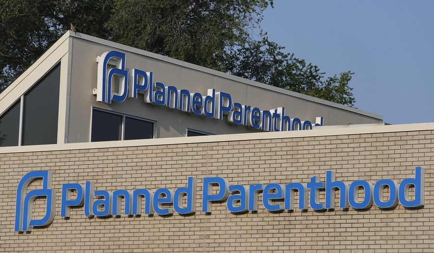 A Planned Parenthood sign is displayed on the outside of the clinic, Aug. 1, 2023, in Indianapolis. (AP Photo/Darron Cummings, File)