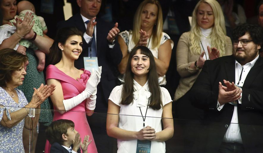 Chloe Cole, center, is recognized by Florida Gov. Ron DeSantis during a joint session for his State of the State speech at the Capitol in Tallahassee, Fla., March 7, 2023. Cole received puberty blockers when she was 13, and underwent a double mastectomy at 15. Now she is an advocate against allowing those procedures on children. (AP Photo/Phil Sears, File)