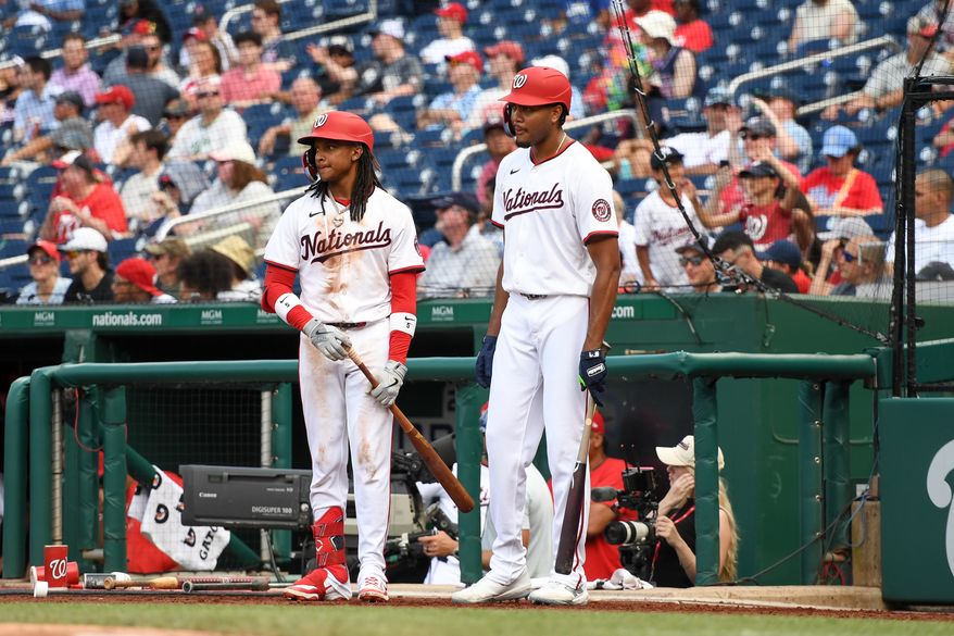 Washington Nationals shortstop C.J. Abrams (5) standing in the on deck circle with left fielder James Wood (29) during a pitching change in the eighth inning of an MLB game against the Colorado Rockies at Nationals Park in Washington D.C., June 19, 2025. (Photo by All-Pro Reels for Washington Times Sports)