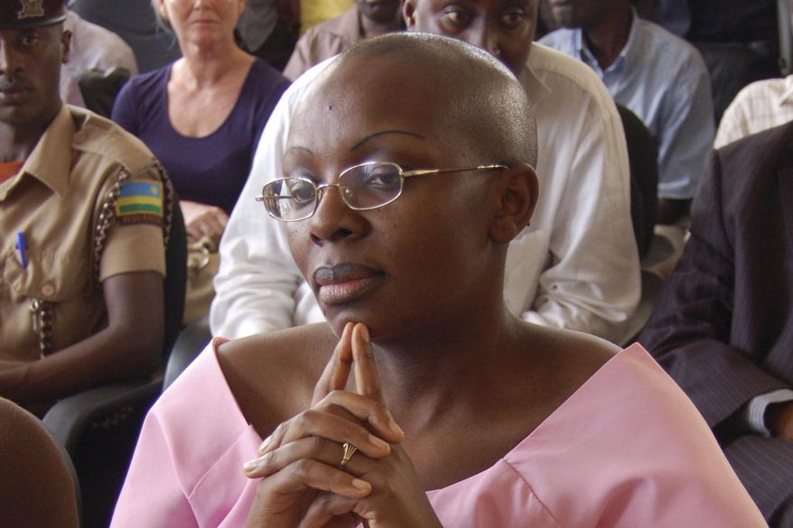 FILE - In this Monday, Sept. 5, 2011 file photo, Rwandan opposition leader Victoire Ingabire listens to the judge during the her trial in Kigali, Rwanda. (AP Photo/Shant Fabricatorian, File)