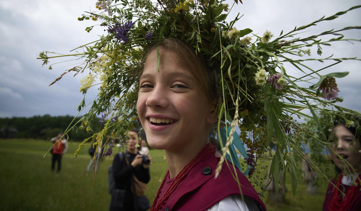 NextImg:Ukrainians celebrate midsummer traditions with song, dance and fire