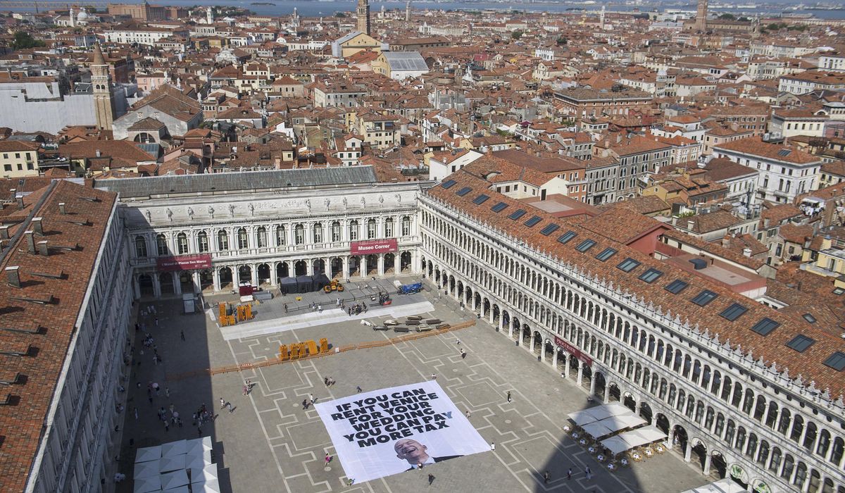 NextImg:Greenpeace joins anti-Bezos protest with Venice banner complaining about billionaire tax breaks