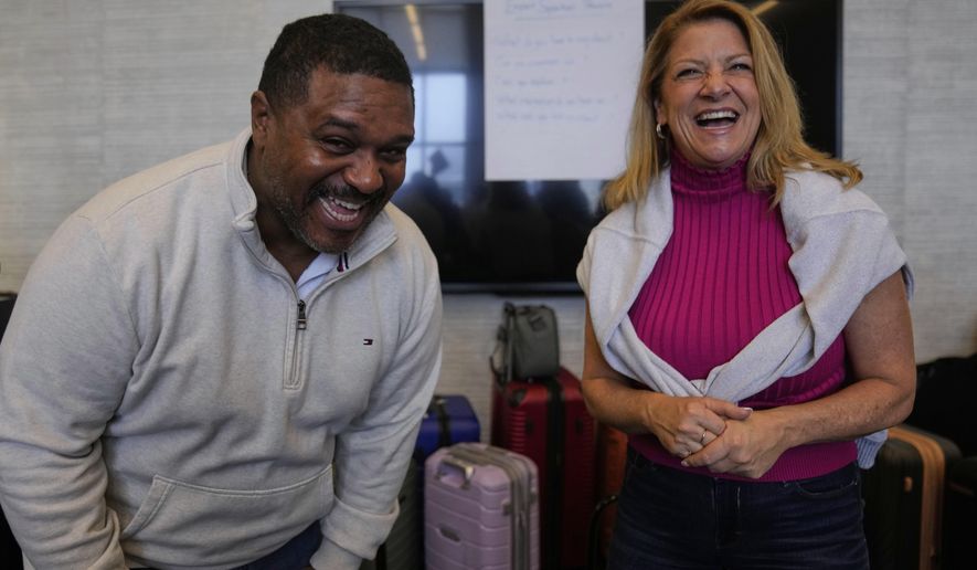 Rocky Mount Police Department Capt. James Staten, left, and Luann Pannell, director of instructional design and academic innovation with the Policing Leadership Academy, participate in an improvisational exercise lead by The Second City instructors during a Univeristy of Chicago Crime Lab class that is part of the Leadership program, on April 11, 2025, in Chicago. (AP Photo/Erin Hooley)
