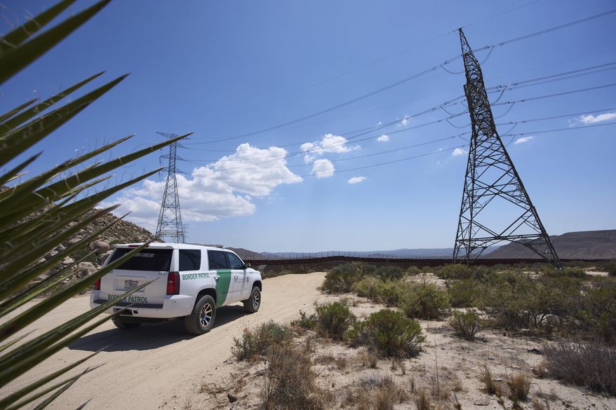 A Border Patrol vehicle sits near where, in years past, volunteers would see hundreds of migrants daily crossing the border separating Mexico and the United States, Thursday, June 5, 2025, near Jacumba Hot Springs, Calif. (AP Photo/Gregory Bull)
