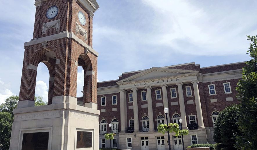 The Autherine Lucy Clock Tower at the Malone Hood Plaza stands in front of Foster Auditorium on the University of Alabama campus in Tuscaloosa, Ala., June 16, 2019. (AP Photo/Bill Sikes, File)