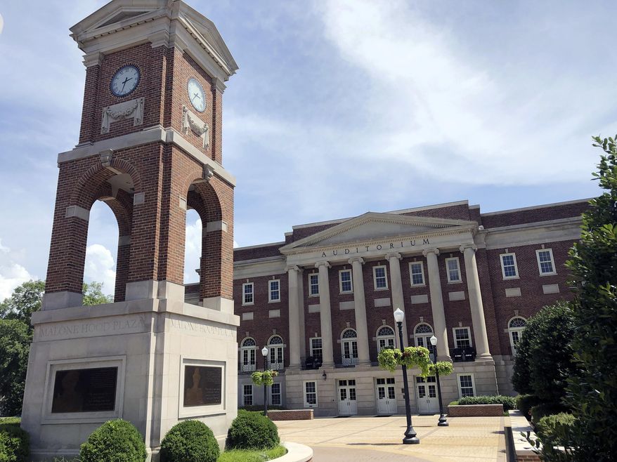 The Autherine Lucy Clock Tower at the Malone Hood Plaza stands in front of Foster Auditorium on the University of Alabama campus in Tuscaloosa, Ala., June 16, 2019. (AP Photo/Bill Sikes, File)