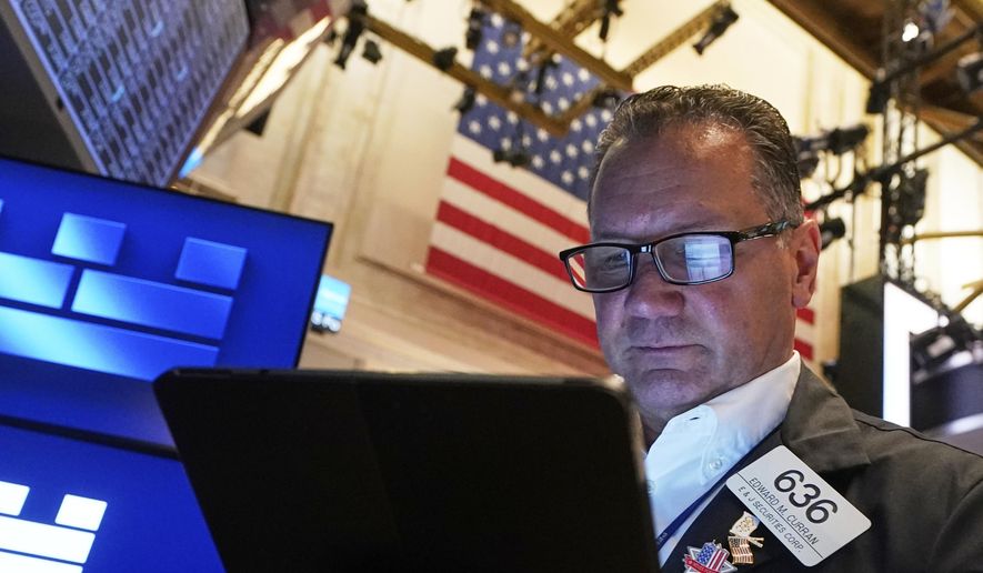 Trader Edward Curran works on the floor of the New York Stock Exchange, Friday, June 27, 2025. (AP Photo/Richard Drew)