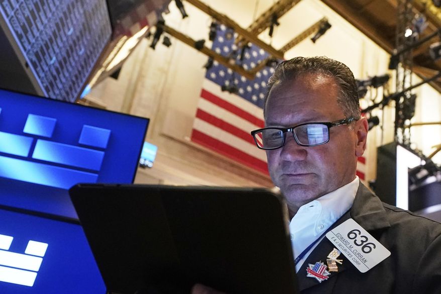 Trader Edward Curran works on the floor of the New York Stock Exchange, Friday, June 27, 2025. (AP Photo/Richard Drew)