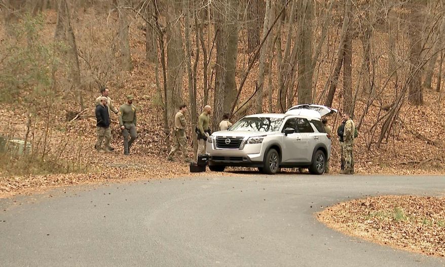 FILE - FBI agents search a neighborhood in Chapel Hill, North Carolina on Feb. 5, 2025, where Teresa Youngblut and Felix Bauckholt, who were involved in the shooting death of a U.S. Border Patrol agent in Vermont, had been renting homes in the neighborhood. (WRAL-TV via AP, File)