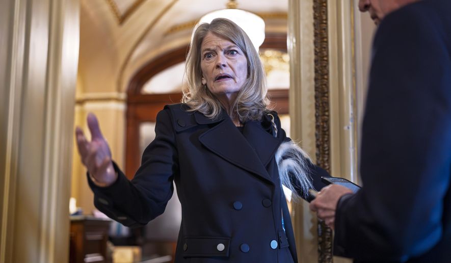 Sen. Lisa Murkowski, R-Alaska, a member of the Senate Appropriations Committee, pauses outside the chamber to answer a question from a reporter at the U.S. Capitol in Washington, March 14, 2025. (AP Photo/J. Scott Applewhite, File)