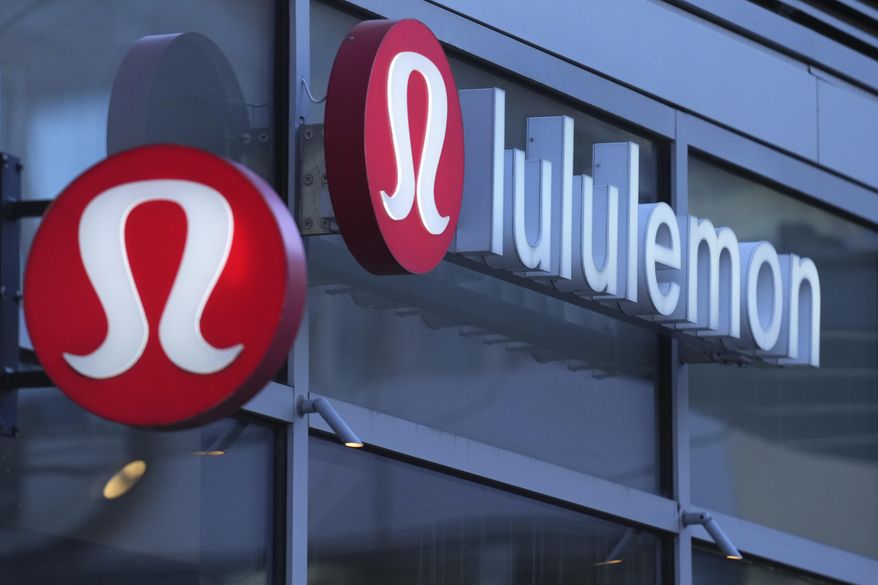 Lululemon signs are displayed outside a retail location in the Seaport District in Boston on Dec. 13, 2024. (AP Photo/Charles Krupa) **FILE**
