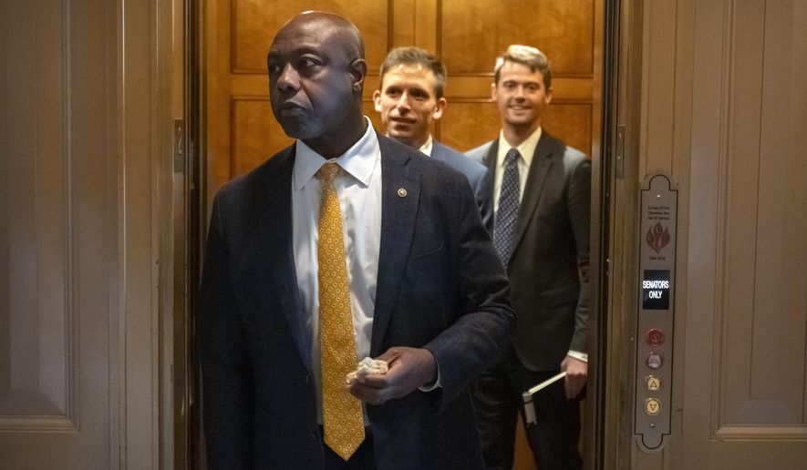 Sen. Tim Scott, R-S.C., steps out of an elevator as Republicans begin a final push to advance President Donald Trump's tax breaks and spending cuts package, at the Capitol in Washington, Monday, June 30, 2025. (AP Photo/Mark Schiefelbein)