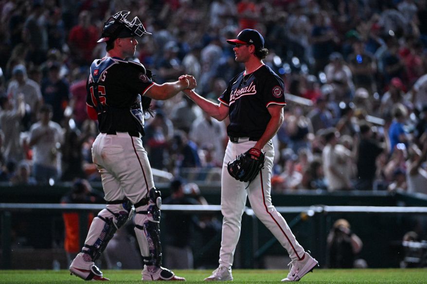 Washington Nationals catcher Riley Adams (15) congratulating relief pitcher Kyle Finnegan (67) after closing out the team’s 11-7 victory over the Detroit Tigers at Nationals Park in Washington D.C., July 3, 2025. (Photo by All-Pro Reels for Washington Times Sports)